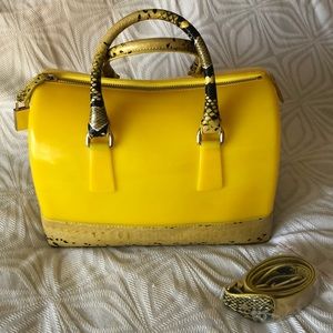 Jelly purse with faux snakeskin bottom and strap.